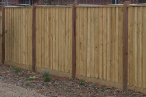 Timber paling fence with exposed posts